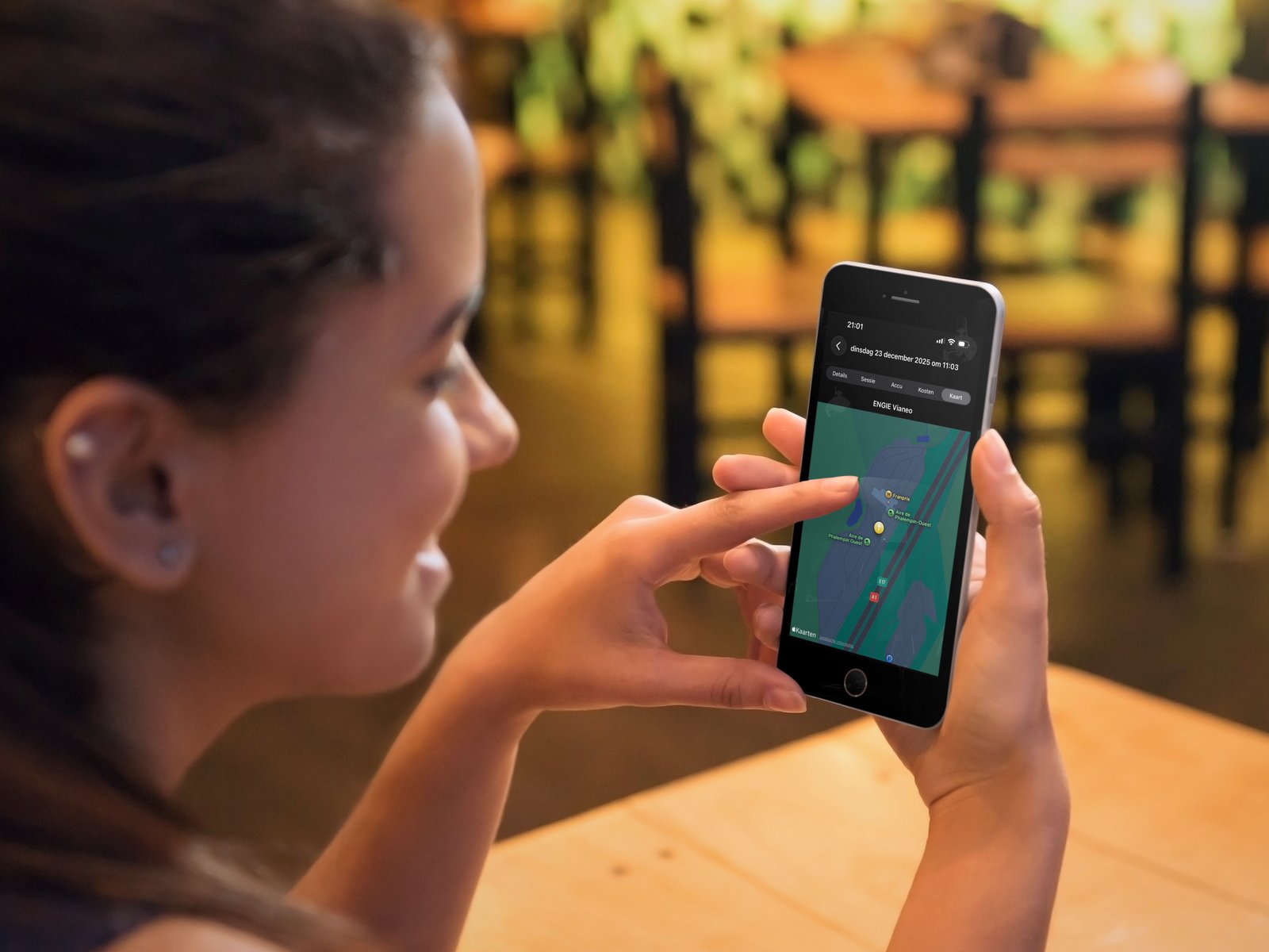 EV Costs app on iPhone shown at a restaurant, displaying a map view of a charging session location