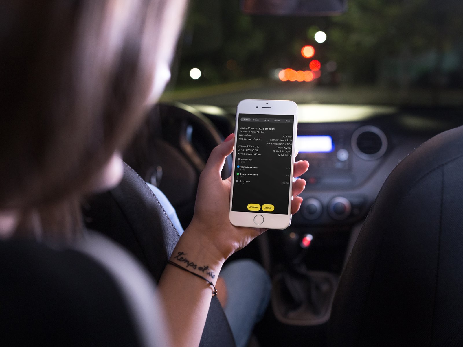 EV Costs app on iPhone shown in a car at night, displaying a charging session detail with kWh and cost
