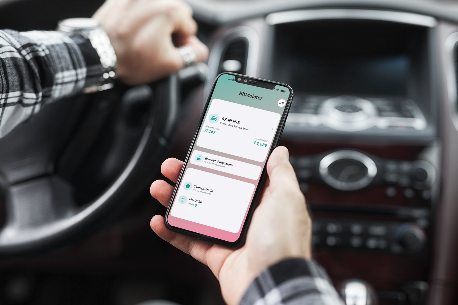 RitMeister app on iPhone displayed in a car, showing the trip dashboard with license plate and totals